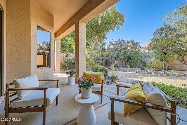 view of patio featuring an outdoor hangout area and a fenced backyard