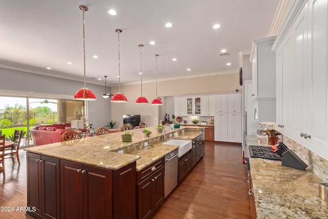 kitchen featuring a large island, decorative backsplash, dark hardwood / wood-style flooring, white cabinetry, and sink