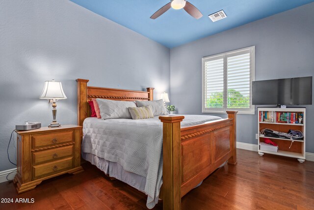 bedroom featuring ceiling fan and dark hardwood / wood-style flooring