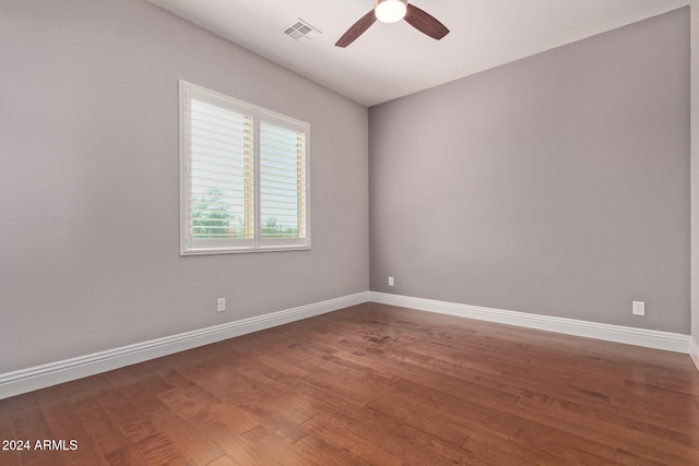 spare room featuring hardwood / wood-style flooring and ceiling fan