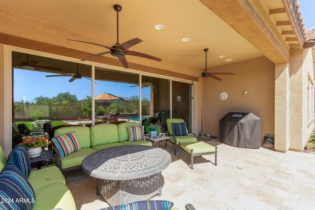 view of patio / terrace with ceiling fan and an outdoor hangout area