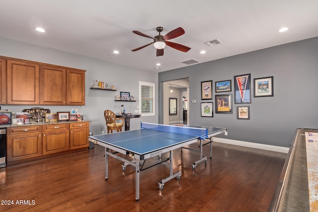 recreation room featuring ceiling fan and dark hardwood / wood-style flooring