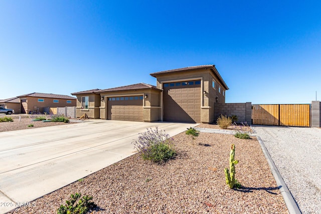 prairie-style home featuring a garage