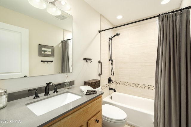 full bathroom with vanity, shower / bathtub combination with curtain, and toilet