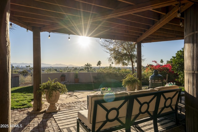 view of patio featuring an outdoor living space and a mountain view