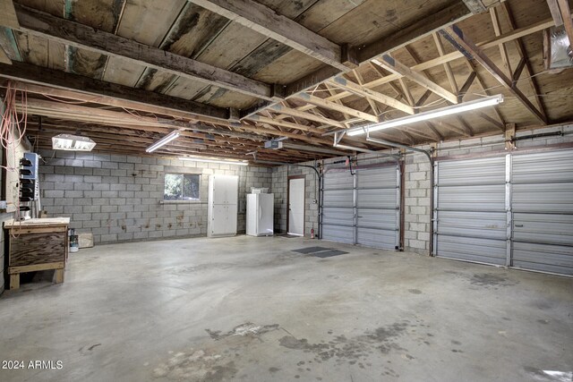 garage featuring white fridge