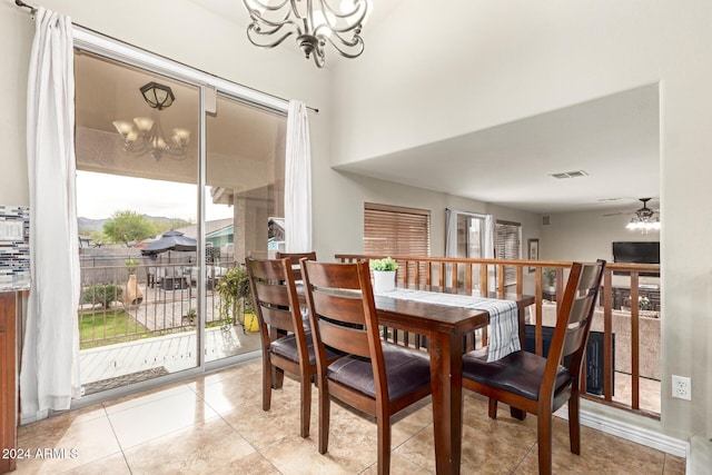 dining room featuring light tile patterned floors, ceiling fan with notable chandelier, and a wealth of natural light