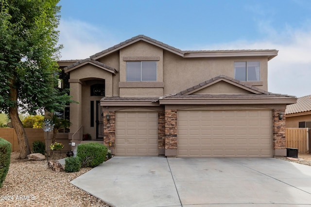 view of front of property featuring a garage