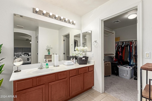 bathroom with vanity, tile patterned floors, and ceiling fan