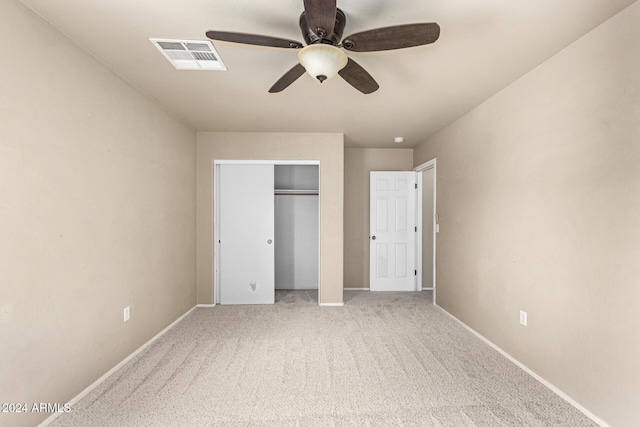 unfurnished bedroom with carpet floors and ceiling fan