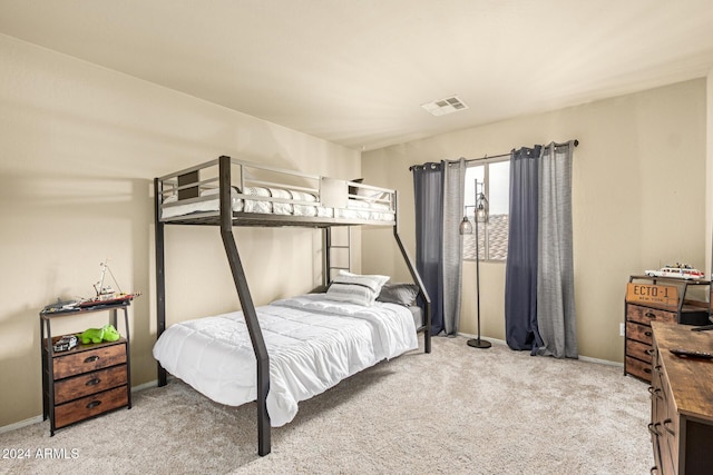 bedroom featuring light colored carpet