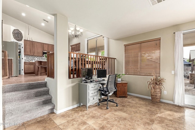 office space featuring a chandelier, vaulted ceiling, and a healthy amount of sunlight