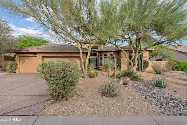 24645 N 117th St, Scottsdale, AZ 85255 - view of front of property with a garage, driveway, and stucco siding