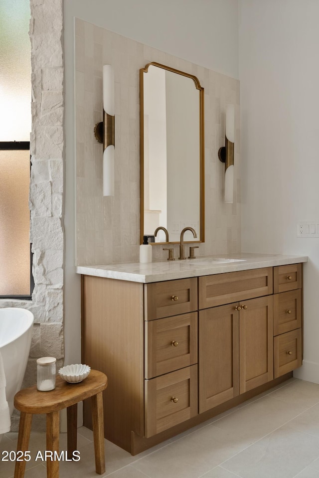 24645 N 117th St, Scottsdale, AZ 85255 - bathroom with vanity, a freestanding tub, and tile patterned flooring