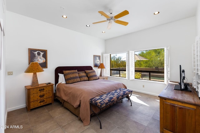 bedroom with tile patterned floors and ceiling fan