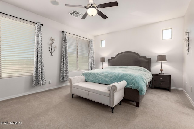 bedroom featuring multiple windows, baseboards, and carpet floors