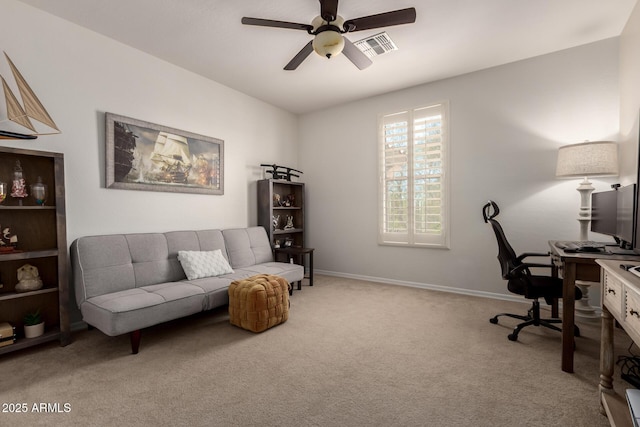office area with ceiling fan, carpet, and baseboards