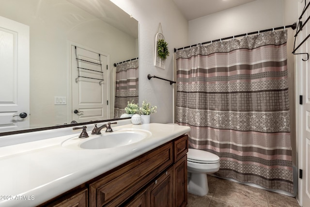bathroom with toilet and vanity