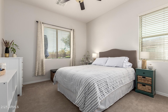 bedroom featuring light carpet, baseboards, and ceiling fan