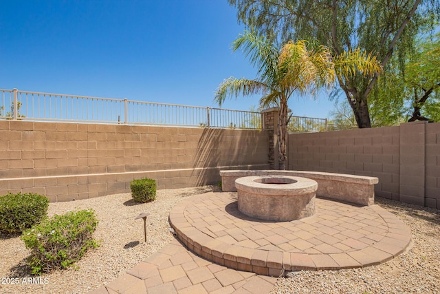 view of patio featuring a fire pit and a fenced backyard