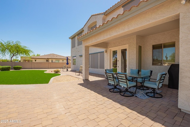 view of patio / terrace with a fenced backyard and french doors
