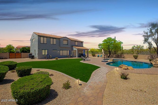 view of swimming pool with a patio and a pool with connected hot tub