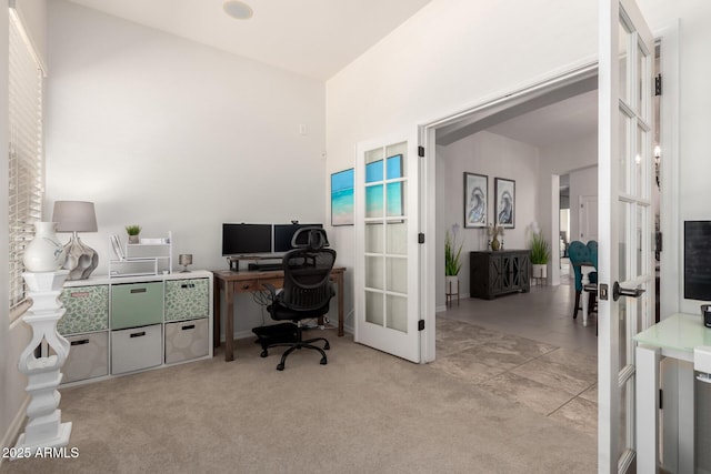 office space featuring french doors and light carpet
