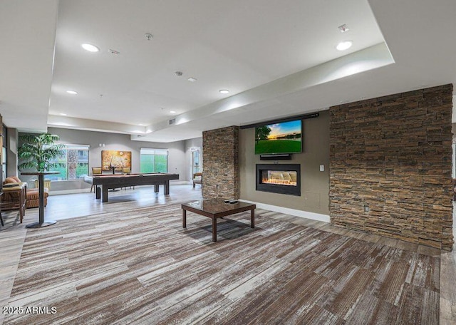 playroom with a tray ceiling and billiards