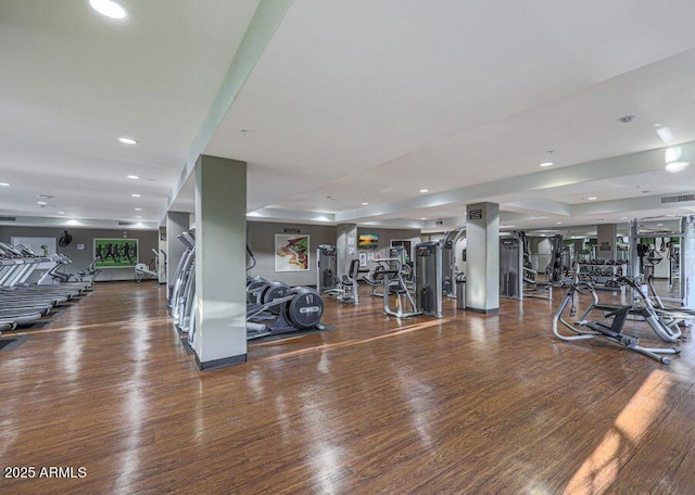 workout area with wood-type flooring