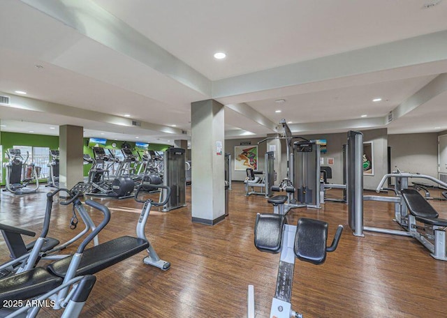 gym featuring dark hardwood / wood-style flooring