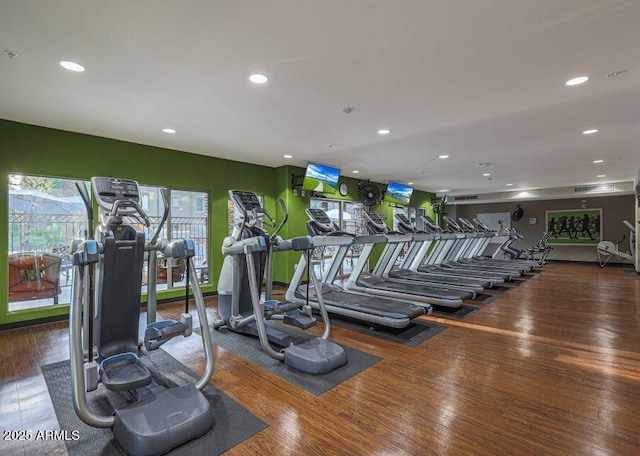 workout area with dark hardwood / wood-style flooring