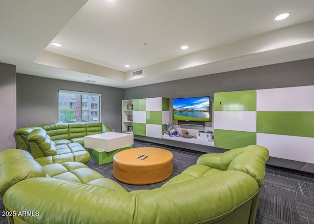 interior space featuring carpet floors and a tray ceiling