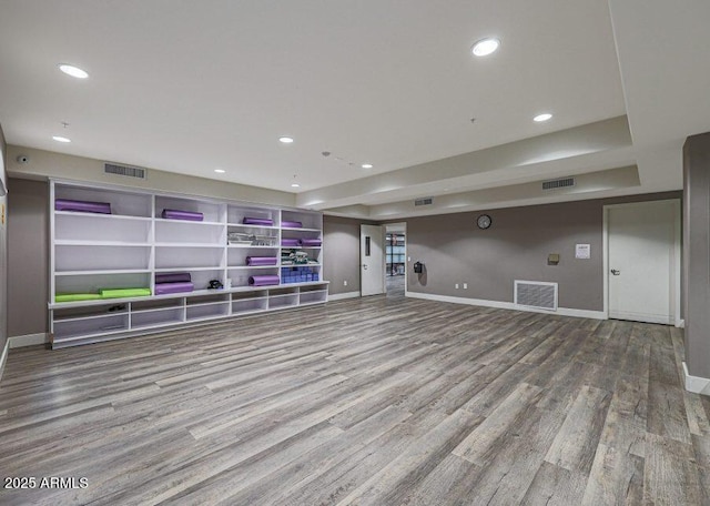 basement with hardwood / wood-style floors