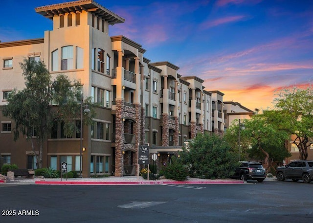 view of outdoor building at dusk