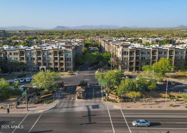 birds eye view of property featuring a mountain view