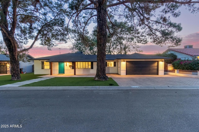 6628 N 2nd Ave, Phoenix, AZ 85013 - single story home with driveway, an attached garage, and a front yard