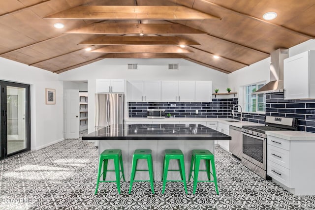 6628 N 2nd Ave, Phoenix, AZ 85013 - kitchen with stainless steel appliances, wall chimney range hood, a sink, open shelves, and white cabinets