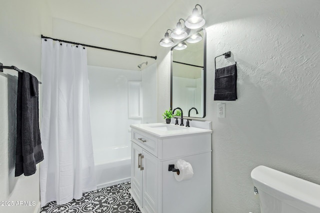 6628 N 2nd Ave, Phoenix, AZ 85013 - full bathroom with vanity, shower / tub combo with curtain, toilet, tile patterned floors, and a textured wall