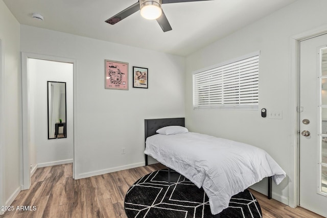 6628 N 2nd Ave, Phoenix, AZ 85013 - bedroom with wood finished floors, baseboards, and ceiling fan