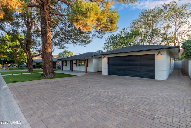6628 N 2nd Ave, Phoenix, AZ 85013 - single story home featuring an attached garage and decorative driveway
