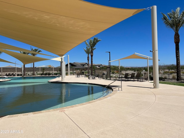 view of swimming pool featuring a patio area