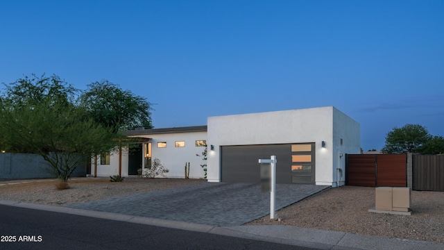 14025 N 11th Pl, Phoenix, AZ 85022 - contemporary house featuring a garage, driveway, stucco siding, and a gate