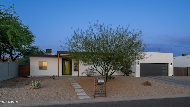 14025 N 11th Pl, Phoenix, AZ 85022 - view of front of property featuring a garage, driveway, and stucco siding