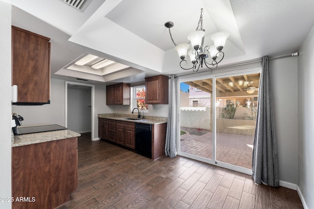 kitchen with a raised ceiling, sink, dark hardwood / wood-style flooring, and black appliances