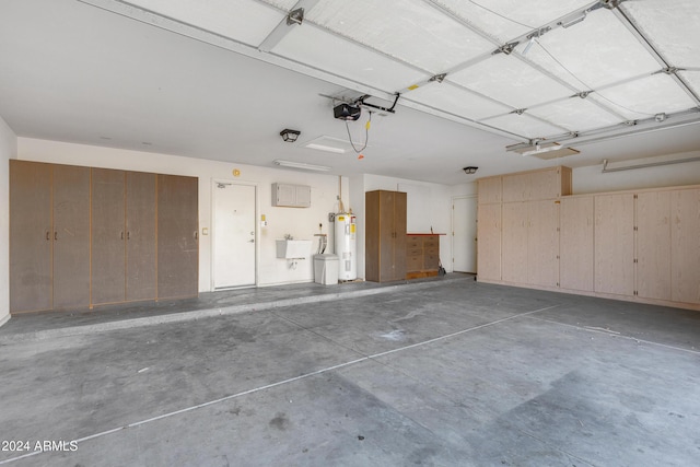 garage featuring water heater and a sink