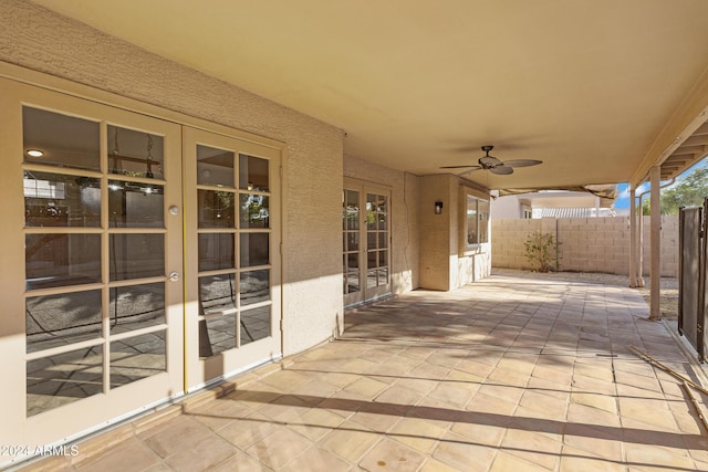 view of patio / terrace featuring ceiling fan and french doors