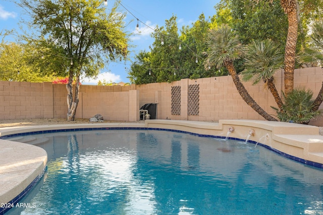 view of pool with a fenced in pool and a fenced backyard