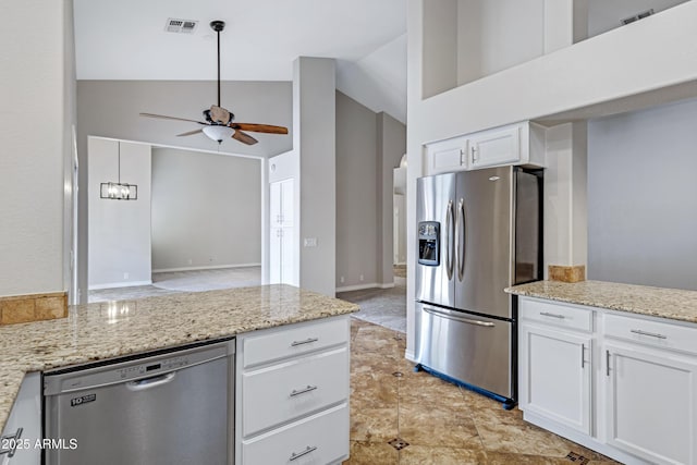 kitchen with visible vents, white cabinets, ceiling fan, appliances with stainless steel finishes, and a peninsula