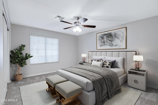 bedroom featuring carpet floors, baseboards, visible vents, and a ceiling fan