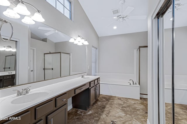 full bathroom featuring visible vents, a sink, a shower stall, and ceiling fan with notable chandelier